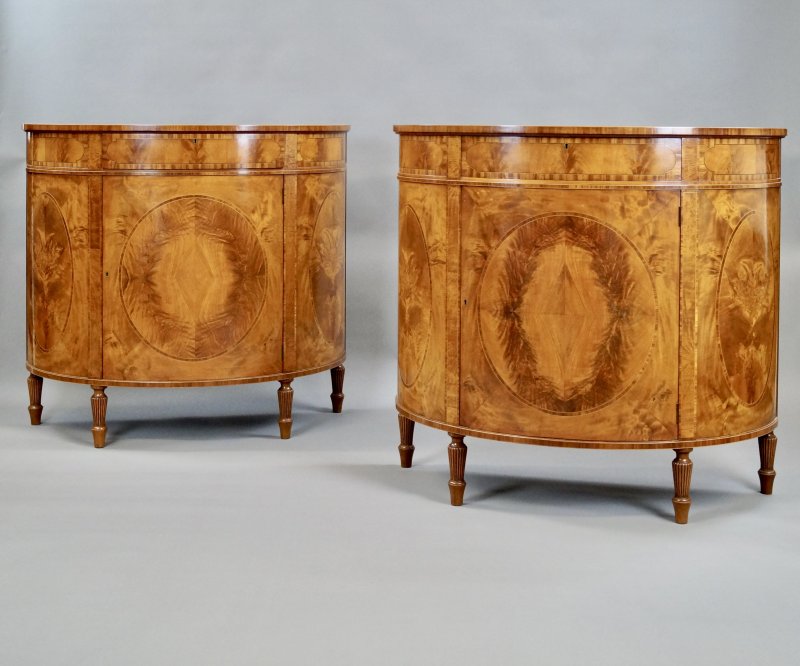 A Fine Pair Of Satinwood Demi Lune Commodes