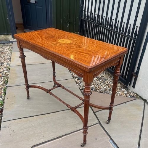 A Late Victorian Period Satinwood Fold Over Games Table.