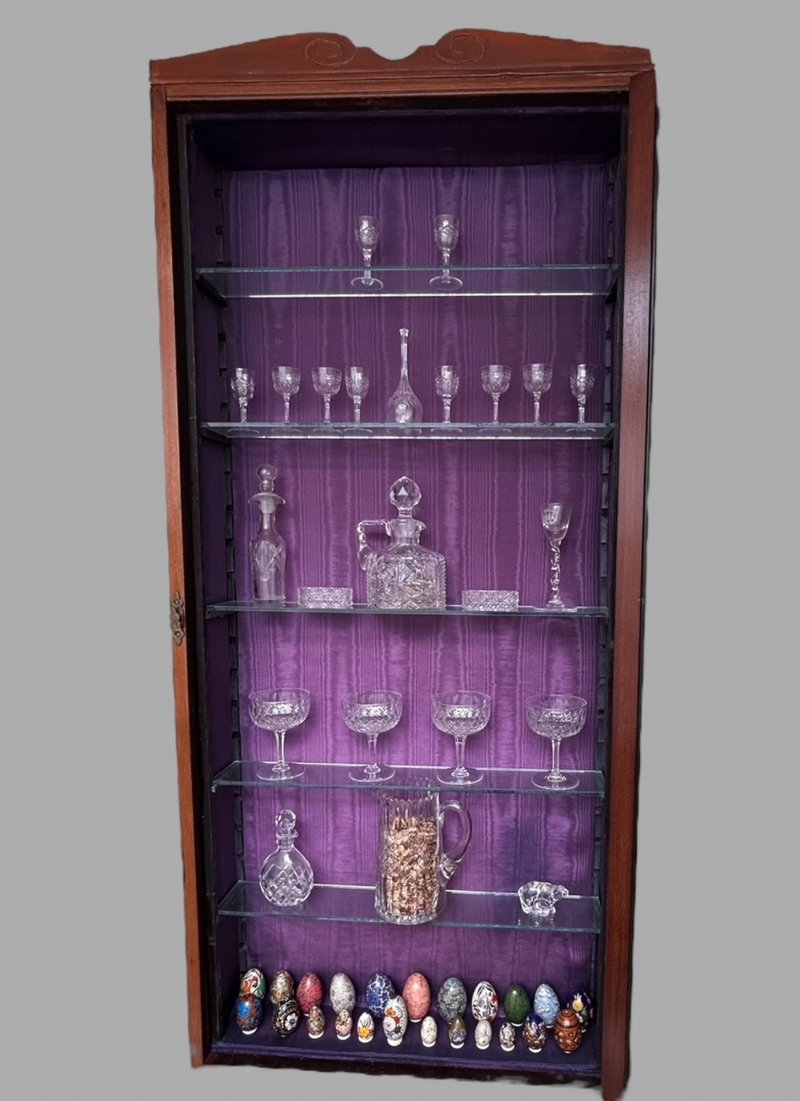 A Wall Hanging Cabinet with Glass Shelving