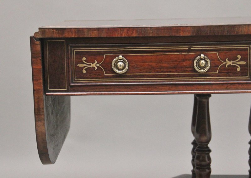 Regency rosewood and brass inlaid sofa table