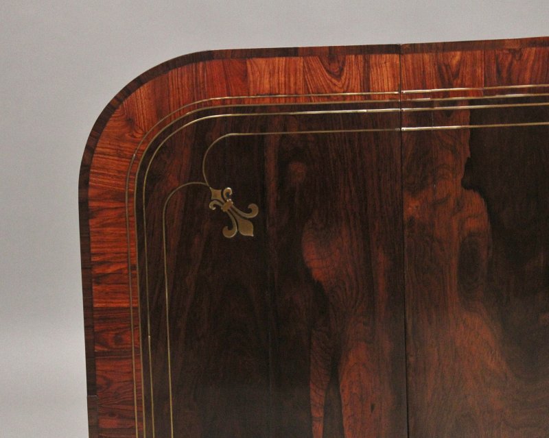 Regency rosewood and brass inlaid sofa table