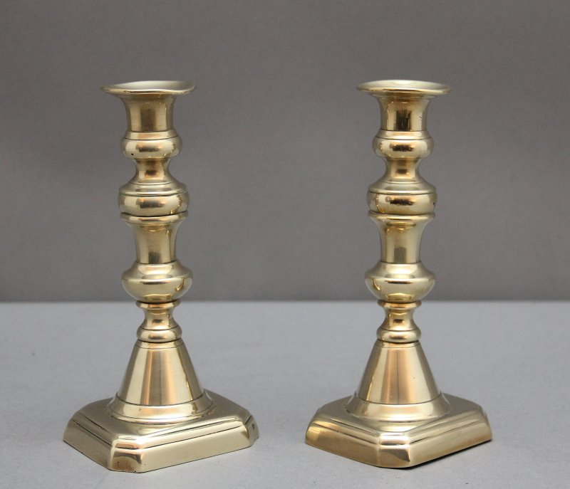 A pair of 19th Century brass candlesticks