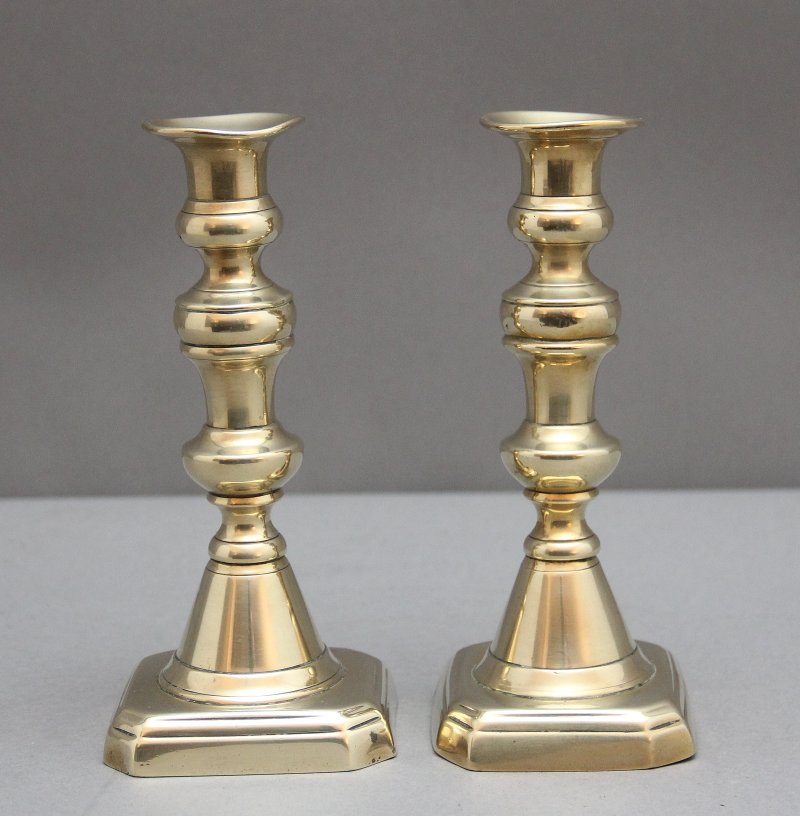 A pair of 19th Century brass candlesticks