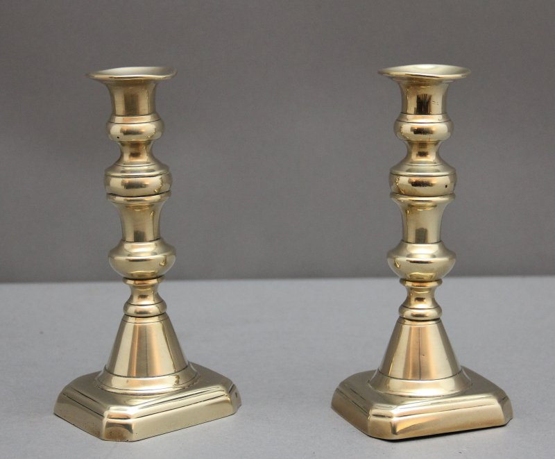 A pair of 19th Century brass candlesticks