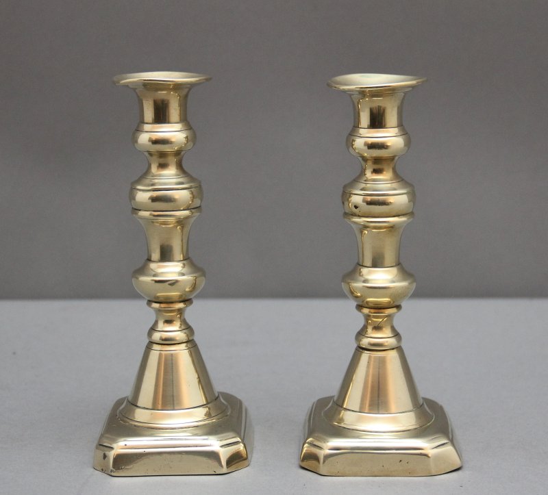 A pair of 19th Century brass candlesticks