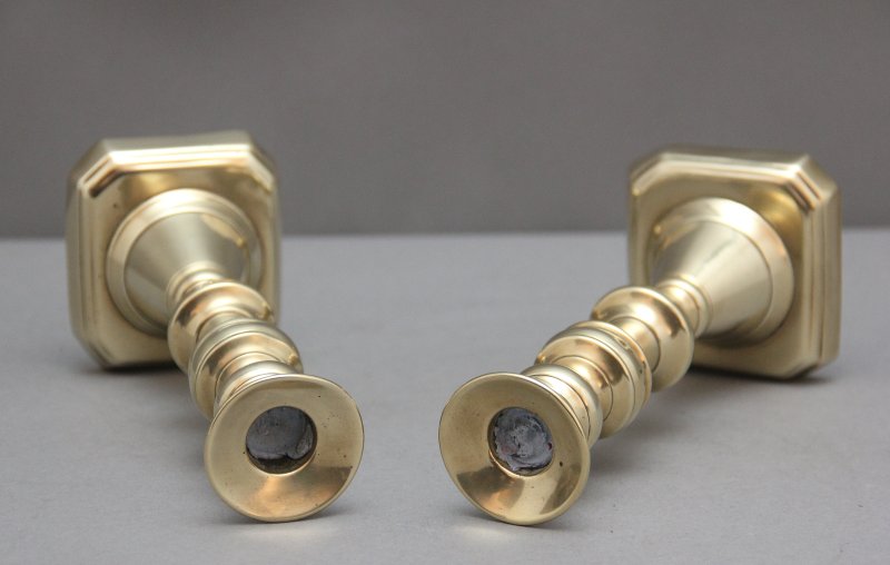 A pair of 19th Century brass candlesticks
