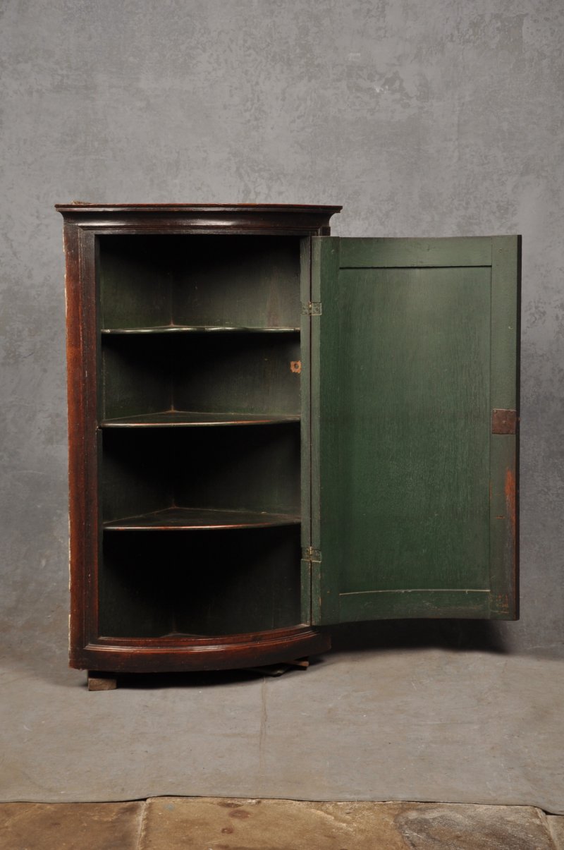 Early 18th Century Oak Bow Fronted Corner Cupboard
