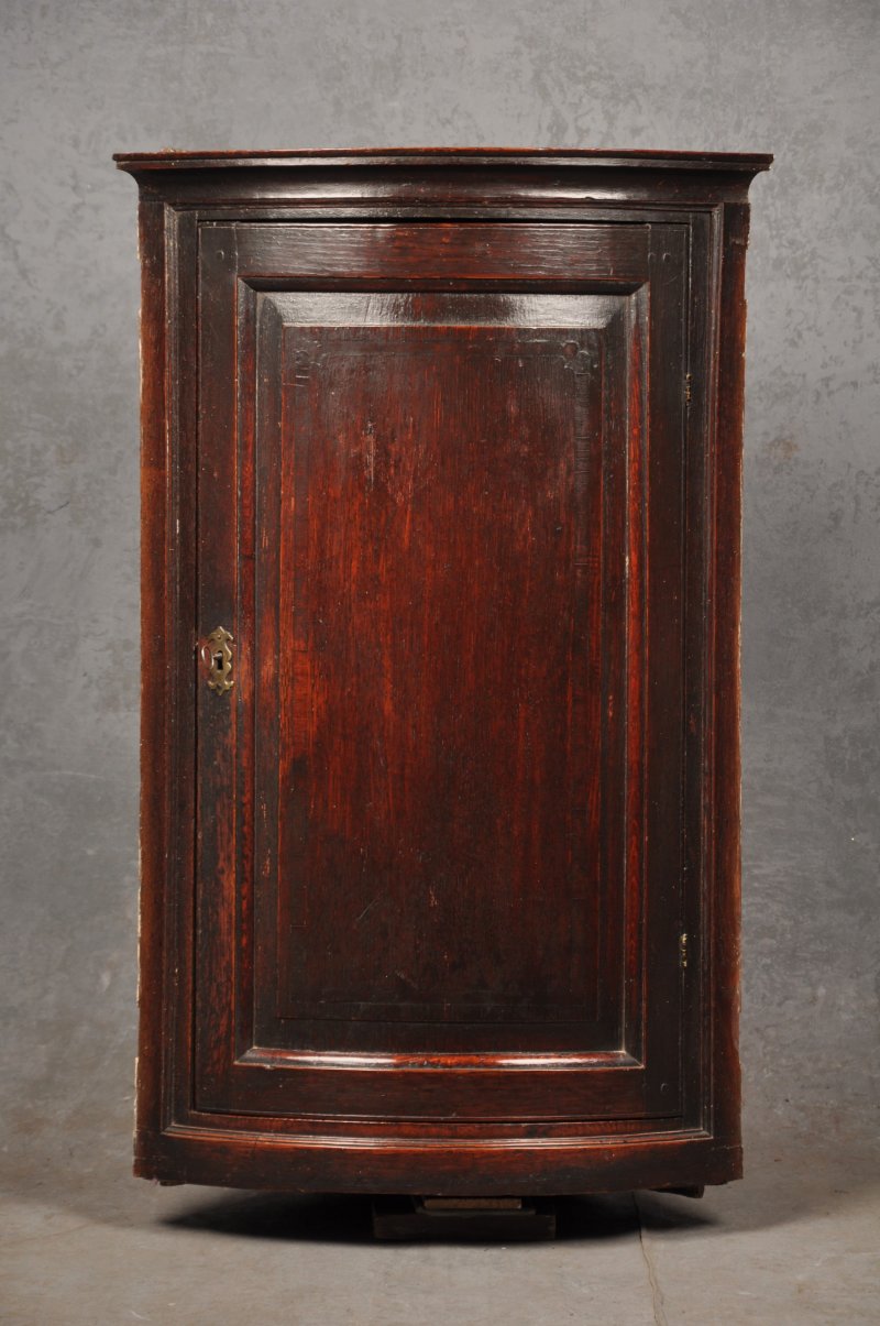 Early 18th Century Oak Bow Fronted Corner Cupboard
