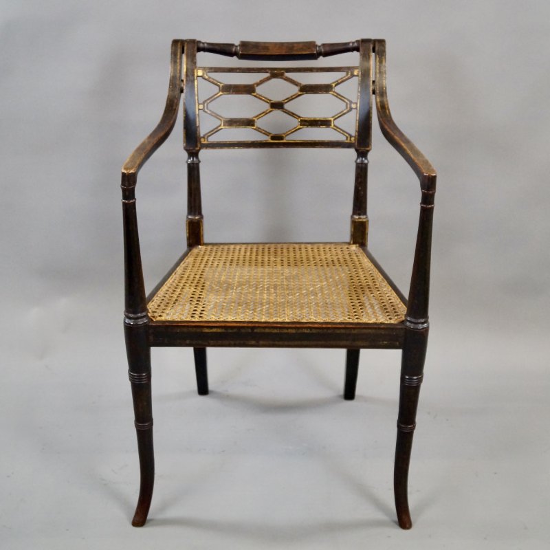 A Fine Regency Ebonised & Gilt Decorated Arm Chair