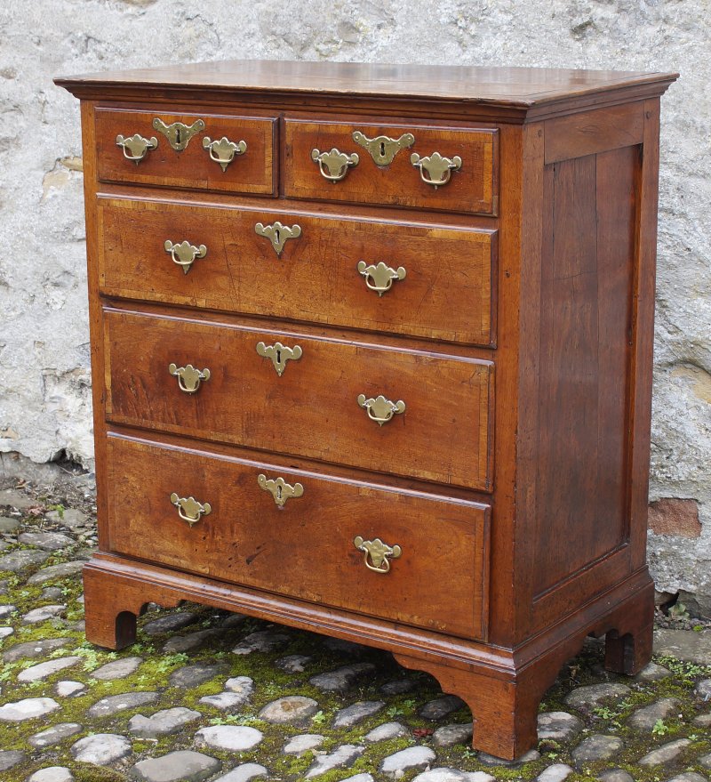 A Small Early Georgian Solid Walnut Chest Of Drawers.