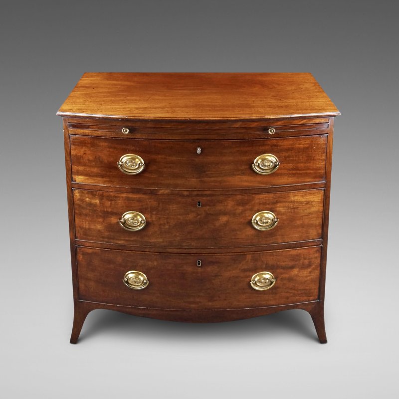 A George III Mahogany Bow-Fronted Chest Of Drawers