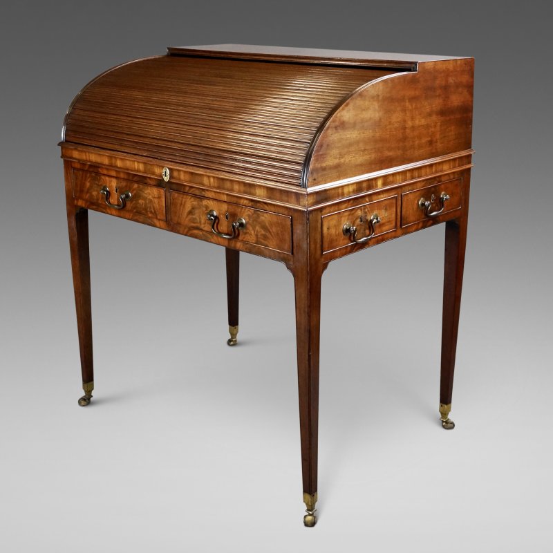 A Fine George III Flame Mahogany Roll-Top Desk