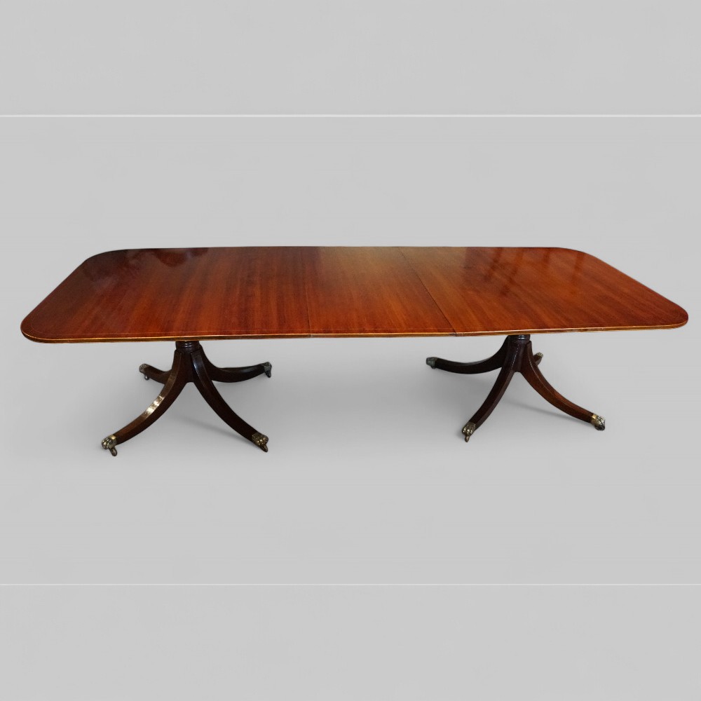 Large George V mahogany inlaid dining table