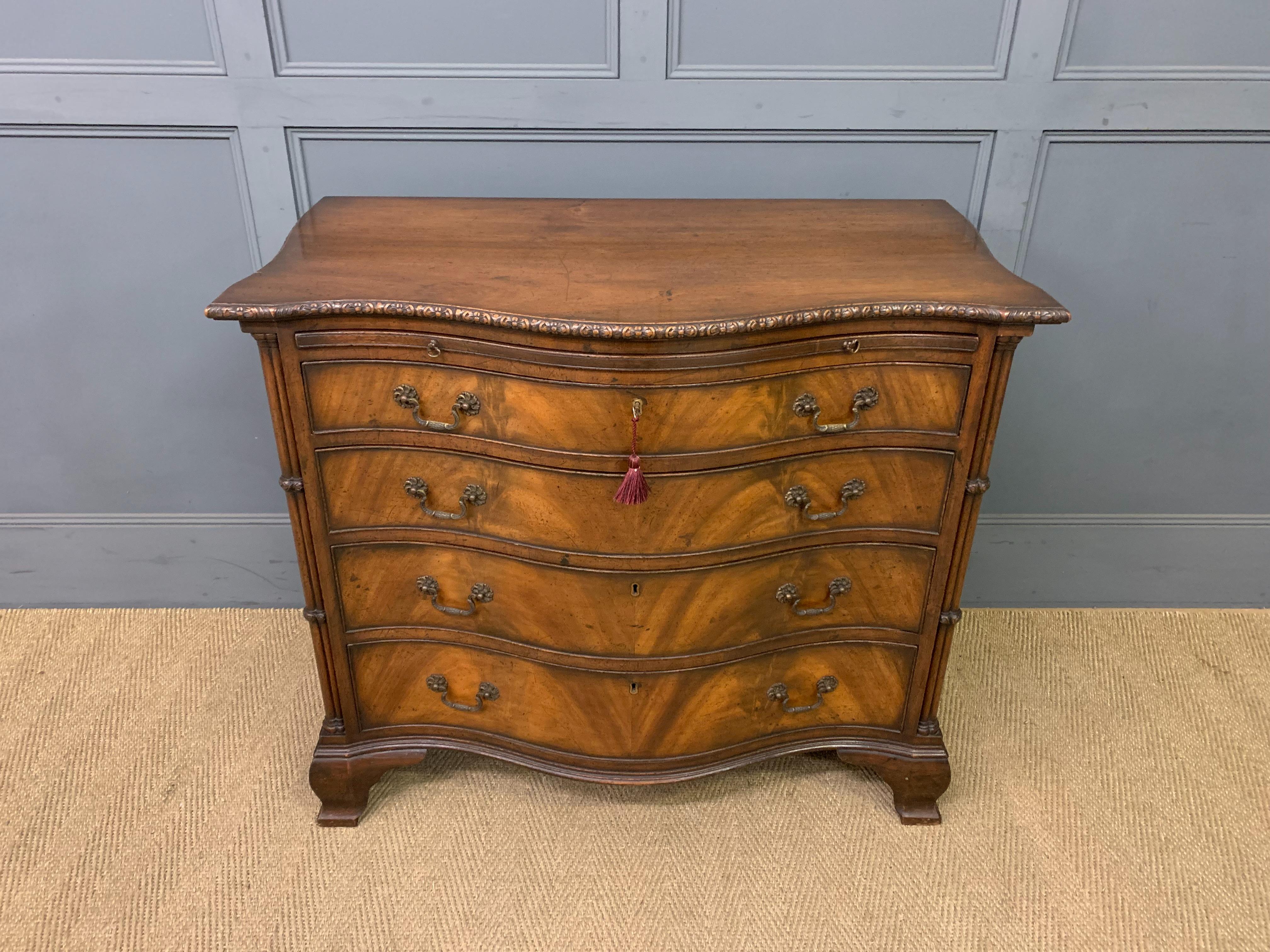 Serpentine Chest of Drawers by Waring and Gillow